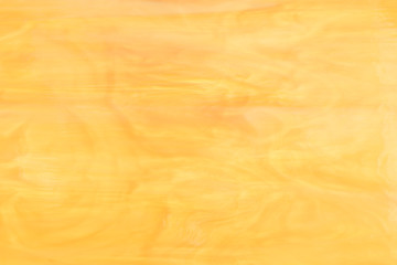 Yellow glass texture. Stained glass. Soft blurred focus.