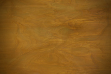 Yellow dark glass texture with vignetting. Soft blurry focus.