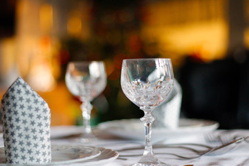 festive decorated table with crystal glasses and Bokeh effect