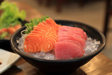 Japanese foods, fresh salmon and tuna sashimi sliced served on ice.
