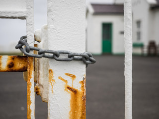 Chain wrapped around a gate at the lighthouse