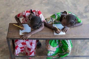 Two Beautiful African Girls Working Hard in School
