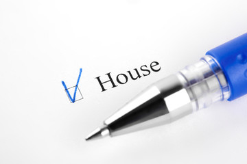 House. Filling in the questionnaire, documents. The checkboxes are filled with a black pen on a white background. Questionnaire, survey.