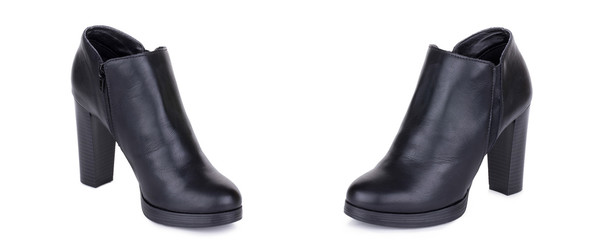Pair of classical woman leather ankle boots booties shoes. Two isolated.