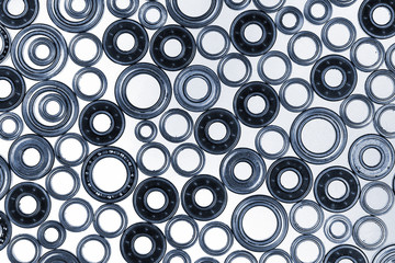 Many small ball bearings on white background