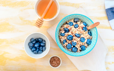 buckwheat porridge with fruits and honey, chia seeds, flax seeds, the concept of a healthy breakfast, diet, veganism, vitamins
