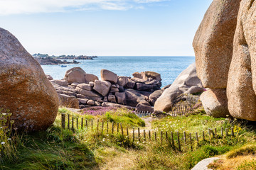 View over the granite blockfield of Ploumanac'h along the GR34 coastal path, called the "sentier des douaniers", on the Pink Granite Coast in northern Brittany, France.