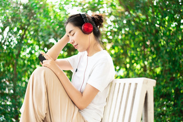 Young girl listen to music from headphone