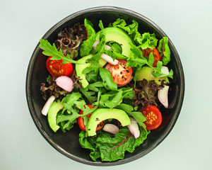 salad healthy, vegetables (avocado, tomato, mix leaves, arugula, lettuce, onions and more) top menu concept. food background. copy space