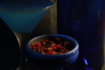 bowl with tobacco for hookah. fruits on a black background