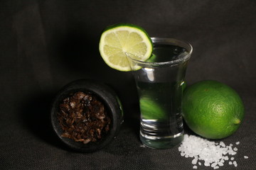 bowl with tobacco for hookah. fruits on a black background. smoking hookah