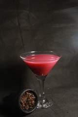 bowl with tobacco for hookah. fruits on a black background