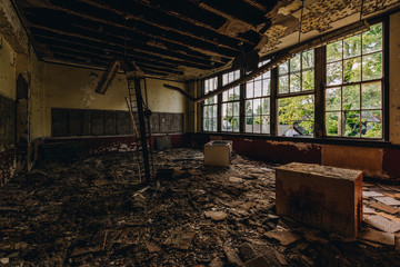 Fototapeta na wymiar Derelict Classroom with Broken Windows - Abandoned Silver Creek School - New York