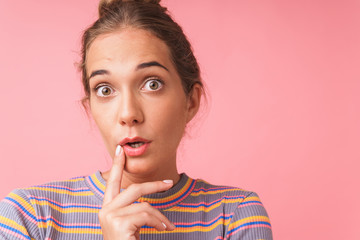 Fototapeta premium Image closeup of surprised beautiful woman expressing wonder with big eyes while looking at camera