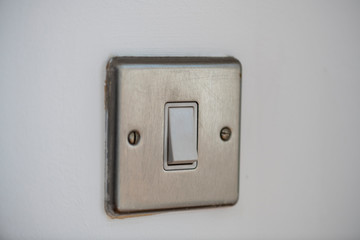 Light switch, brushed metal.