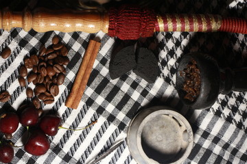 bowl with tobacco for hookah. berries on a black background