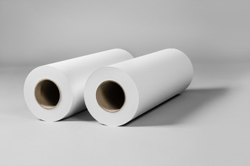 Blank white paper rolls isolated on gray background. Mockup paper for magazines, catalogs or newspapers isolated on gray backdrop, Printing house theme or wrapping paper for presents
