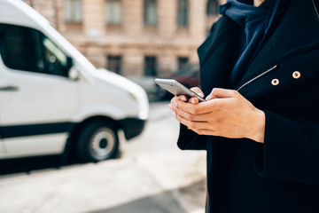 Close-up young woman wearing black coat