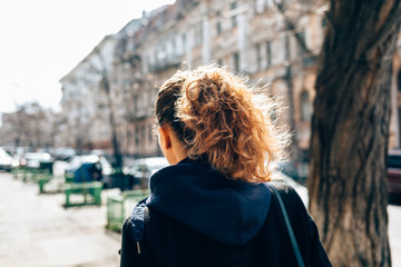 Young woman in black coat
