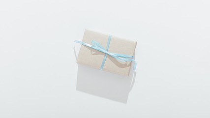 Gift box tied with blue ribbon