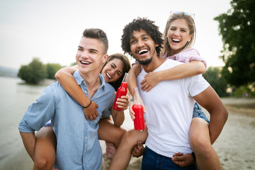 Happy people having fun in summer holidays. Friends, vacation, summer lifestyle and youth concept