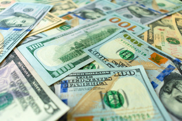  American banknotes of different denominations. Background from dolars.