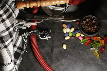 bowl with tobacco for hookah. berries on a black background