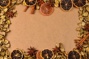Fototapeta na wymiar Autumn background with golden leaves, dried fruts, cinnamon and anis. Space for text or design.
