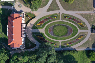 Old manor park and flower beds from drone, aerial