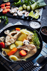 Trout fish soup in a bowl, close-up