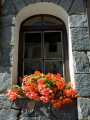 Fototapeta na wymiar window of retro house with flowers
