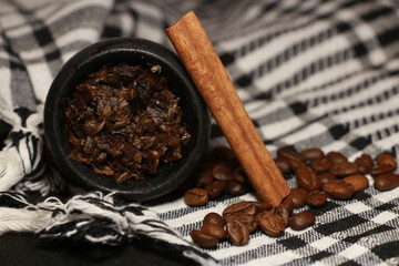 bowl with tobacco for hookah. fruits on a black background