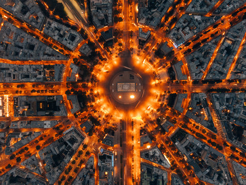 Aerial of the Arc de Triomphe in Paris, France at night