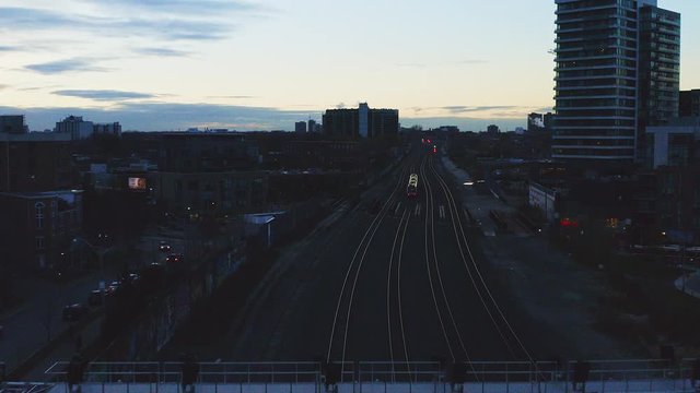 Aerial tracking shot of UP express train going to Toronto Pearson International Airport