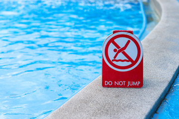 Warning signs, do not jump into this area of the pool.