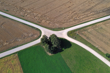 Aerial view of a country road crossroads in summer