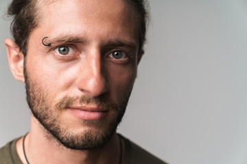 Handsome young bearded guy wearing casual clothing isolated