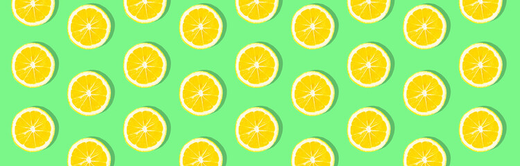 Obraz premium Fresh lemon (lemons) pattern on pink background. Minimal concept. Summer minimal concept. Flat lay