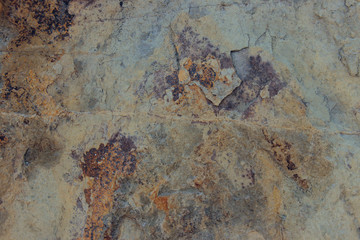 Blurred image of stone wall texture. Abstract texture background, brown colors.