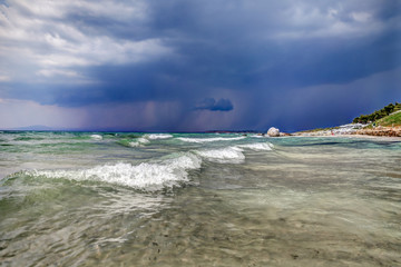 Stormy skies approaching a Greek beach resort