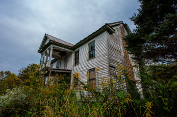 Abandoned House with Clapboard Siding and Porches - Tall Goldenrod Wildflowers - Lewis County,...