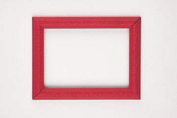 Red border wooden frame on white background