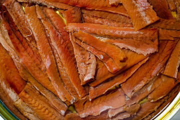 Fototapeta na wymiar Closeup of tinned anchovy fillets in oil