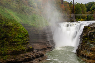 Fototapeta na wymiar Upper Falls - Waterfall + Autumn/Fall Colors at Letchworth State Park - Finger Lakes Region of New York