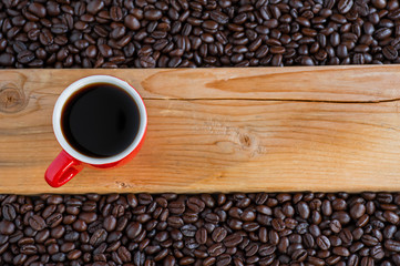 Red coffee cups and beans on the table The top view has space for your messages.