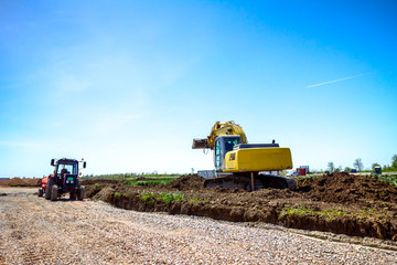 Fototapeta premium Excavator is digging on building site