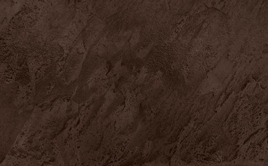 Close up of abstract dark brown stone texture with high resolution.