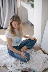 Woman painter drawing picture