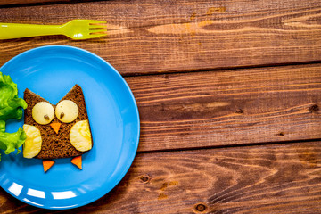 kids breakfast owl shaped sandwich on blue plate top view