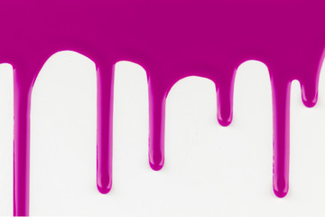 Dripping pink paint on white background